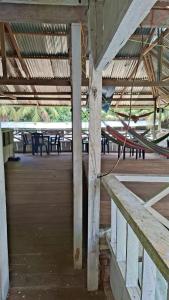an empty building with tables and benches in the background at Macedonia Lodge in Macedonia