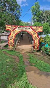 a bridge with a person standing under it at Macedonia Lodge in Macedonia