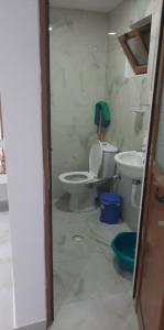 a bathroom with a toilet and a sink at Guest House Luani in Ksamil