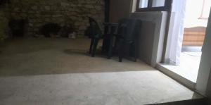 a living room with two chairs and a table at Guest House Luani in Ksamil