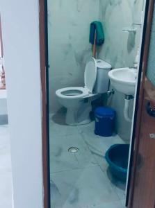 a bathroom with a toilet and a sink at Guest House Luani in Ksamil