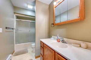 a bathroom with a sink and a shower at Wooded Applegate Retreat w/ Private Trail Access in Applegate +23 photos