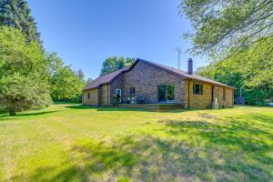 an old brick house with a large yard at Wooded Applegate Retreat w/ Private Trail Access in Applegate