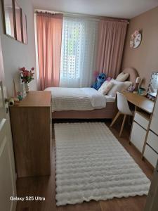 a small bedroom with a bed and a desk at Kristiansand Mosby1 in Kristiansand