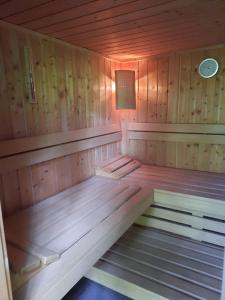 a inside of a sauna with a light on it at Chalet dans la nature avec spa in Espins