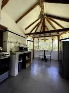 a large kitchen with a table and chairs in it at Aldealma in Pisac