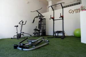 a gym with several exercise bikes in a room at Argassi Beach Hotel - Adults Only in Argassi