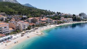 an aerial view of a beach with buildings and the water at Apartment Bogomir in Podgora