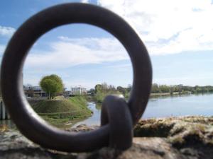 a view of a river through a metal ring at Mercure Nevers Pont De Loire in Nevers