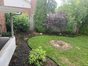a backyard with a yard with a fence and a yard at Luxurious Vacation in Welland +3 photos