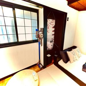 a small room with a bed and a window at Between Kyoto & Osaka 渚西 駅徒歩6分 in Hirakata +17 photos