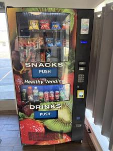 a vending machine filled with drinks and food at Bel Air Motor Lodge in Maple Shade