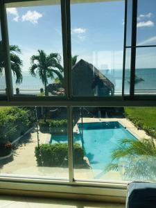 a view of a swimming pool from a window at Casa Malibú Gorgona in Nueva Gorgona