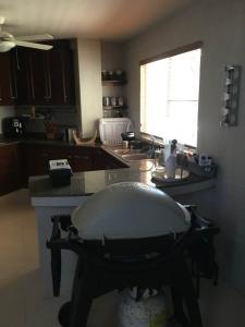 a kitchen with a large island in the middle at Casa Malibú Gorgona in Nueva Gorgona