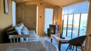 a living room with a couch and a table at Elimar Ocean View in Valdivia
