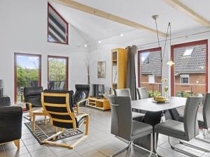 a dining room with a table and chairs at Seestrasse 35 in Insel Poel