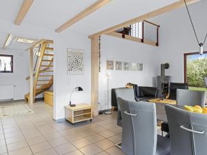 a living room with a table and chairs at Seestrasse 35 in Insel Poel