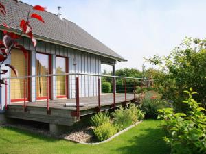 a house with a porch and a garden at Seestrasse 35 in Insel Poel