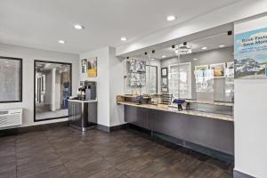 a store lobby with a counter with a coffee shop at Studio 6-Fairfield, CA - Napa Valley in Fairfield