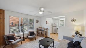 a living room with a couch and a table at Sleeping Bear by AvantStay in North Creek