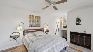 a bedroom with a bed and a fireplace at Sleeping Bear by AvantStay in North Creek +41 photos