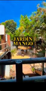 a view of the sign for a marina at Jardín del Mango Nu in Zipolite