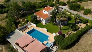 an aerial view of a house with a swimming pool at Villa Ursa by Algarve Holidays in Praia do Carvoeiro