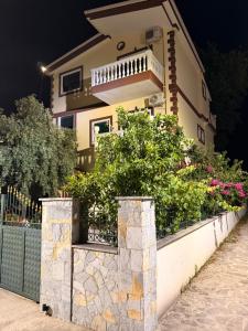 a house with some plants in front of it at Borsh Grove Villa in Borsh