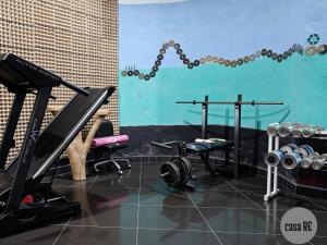 a gym with two treadmills and two weights at Habitación 4 Jiotilla Casa Re in Tehuacán