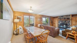 a living room with a table and chairs and a couch at Echo by AvantStay in North Creek