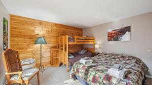 a bedroom with a bed and a bunk bed at Echo by AvantStay in North Creek +38 photos