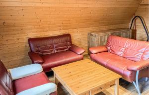 a room with two chairs and a couch and a table at 2 Bedroom Nice Home In Bad Lobenstein in Bad Lobenstein