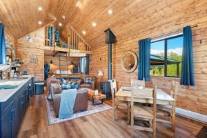 a kitchen and living room in a log cabin at River Retreat Kananaskis in Turner Valley