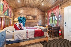 a bedroom with a bed in a wooden cabin at River Retreat Kananaskis in Turner Valley