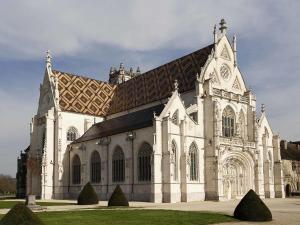 a large white church with a brown roof at ibis Styles Bourg-en-Bresse Centre in Bourg-en-Bresse