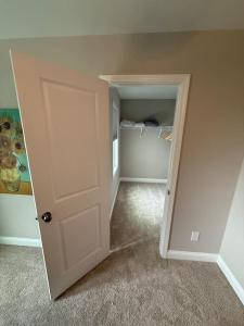 an empty room with a door and a closet at Tide's Turn Retreat in Cedar Point