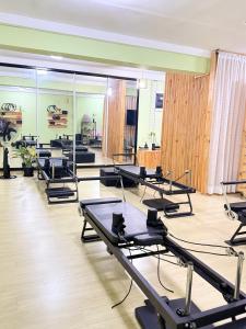 a room with a row of tables and chairs at Julianah appart in Douala