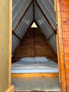a bed in the middle of a tent at Camping El Paraiso in Calima +16 photos