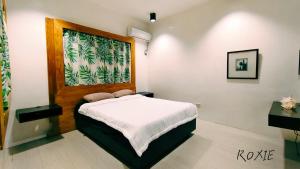 a bedroom with a large bed in a room at PNS BORACAY Station 1 in Boracay +18 photos