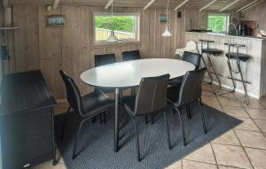 a dining room table and chairs in a kitchen at 3 Bedroom Amazing Home In Haderslev in Haderslev