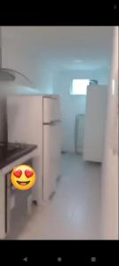 a kitchen with a smiley face emoticon on the counter at Apartamento térreo com 3 quartos no Tree Bies- próximo do parque aquático infantil in Subaúma