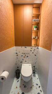 a bathroom with a toilet in a room at Bela Bonita in Spišská Belá