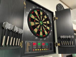 a dart board in a room with darts at 島家 Shimaie in Ōta