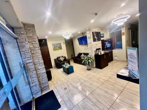 a living room with a couch and a fireplace at Bon Repos Boutique in Arequipa