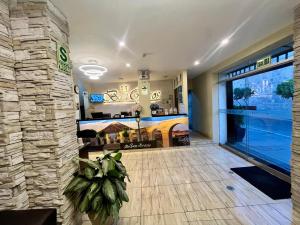 a living room with a stone wall at Bon Repos Boutique in Arequipa