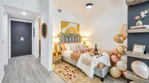 a bedroom with a large bed with a bunch of balloons at Modern Downtown Miami Studio with Skyline View in Miami +16 photos