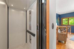 a kitchen with a refrigerator in a room at Bluff Haven by Simple Life Rentals in Fish Creek