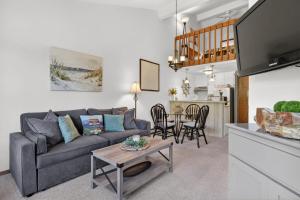 a living room with a couch and a table at Cedar Haven Unit 202 by Simple Life Rentals in Ephraim