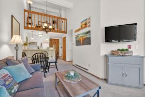 a living room with a couch and a table at Cedar Haven Unit 202 by Simple Life Rentals in Ephraim