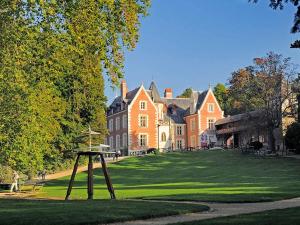 a large house with a disc golf course in front of it at ibis budget Amboise in Amboise